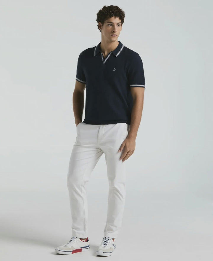 Video of a man wearing the Original Penguin Textured Johnny Collar Sweater Polo in the color Dark Sapphire